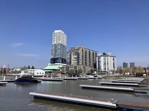 Boats in the Barrie marina with downtown towers behind